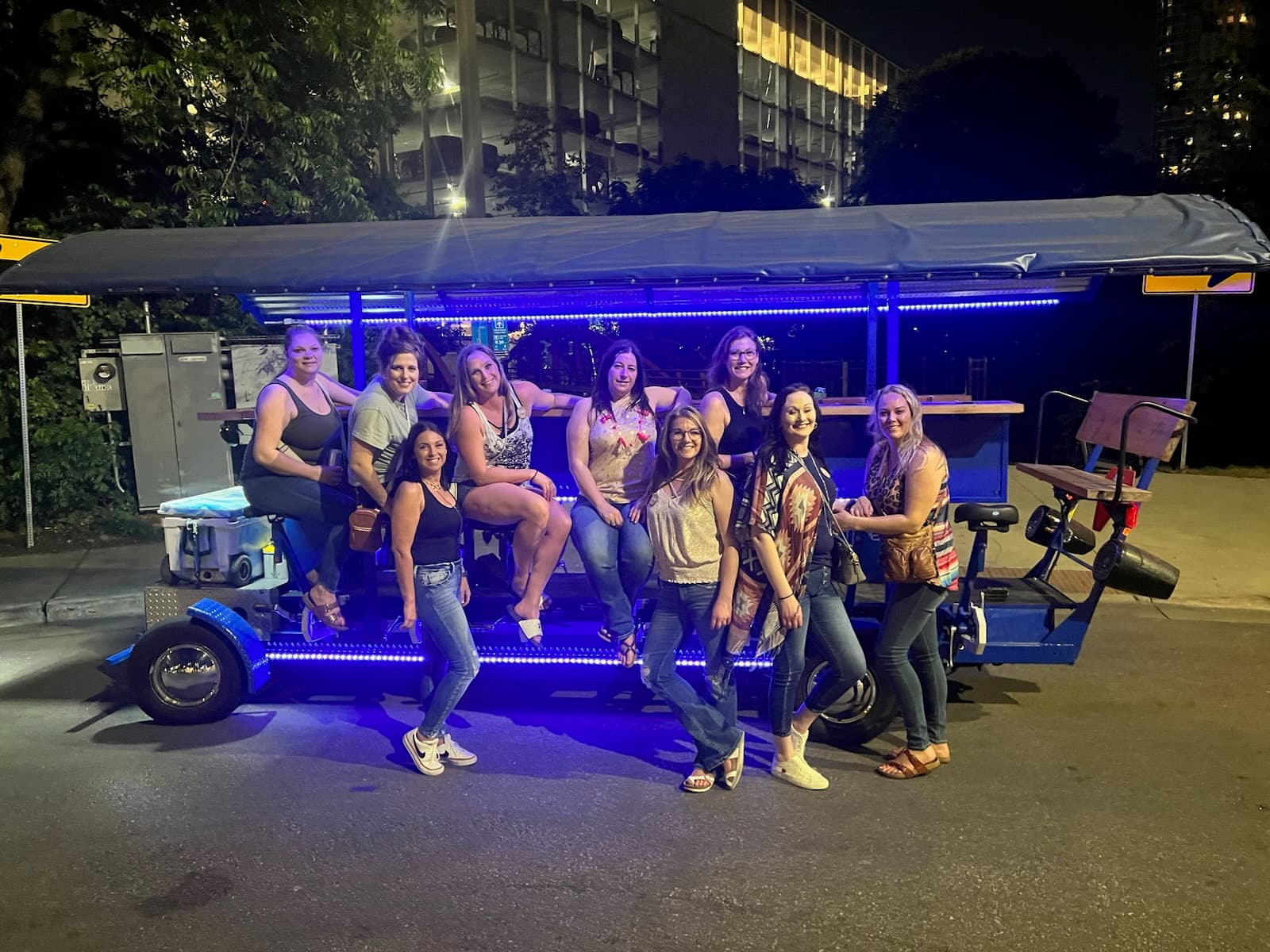 Group of friends celebrating on Austin Bar Bike night ride downtown